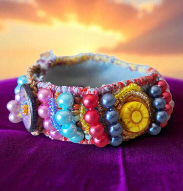 Sun and Fruits hand-stitched textile bracelet Handmade Sun and Fruits textile bracelet from the Road Talismans collection, hand-stitched with colorful beads and bright summer tones