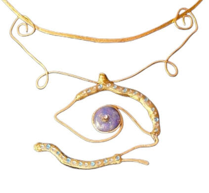 The Traveler's Eye Handmade brass necklace with a hand-painted eye sealed in resin, from the Road Talismans collection.